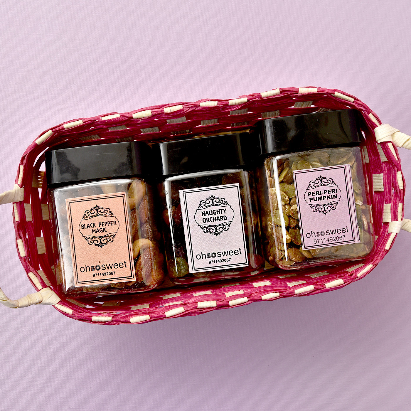 Delightful Flavored Dryfruits & Savouries Cans in Basket